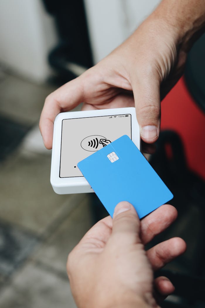 Mastering the First Impression: Your intriguing post title goes here Hands using contactless payment terminal and credit card.